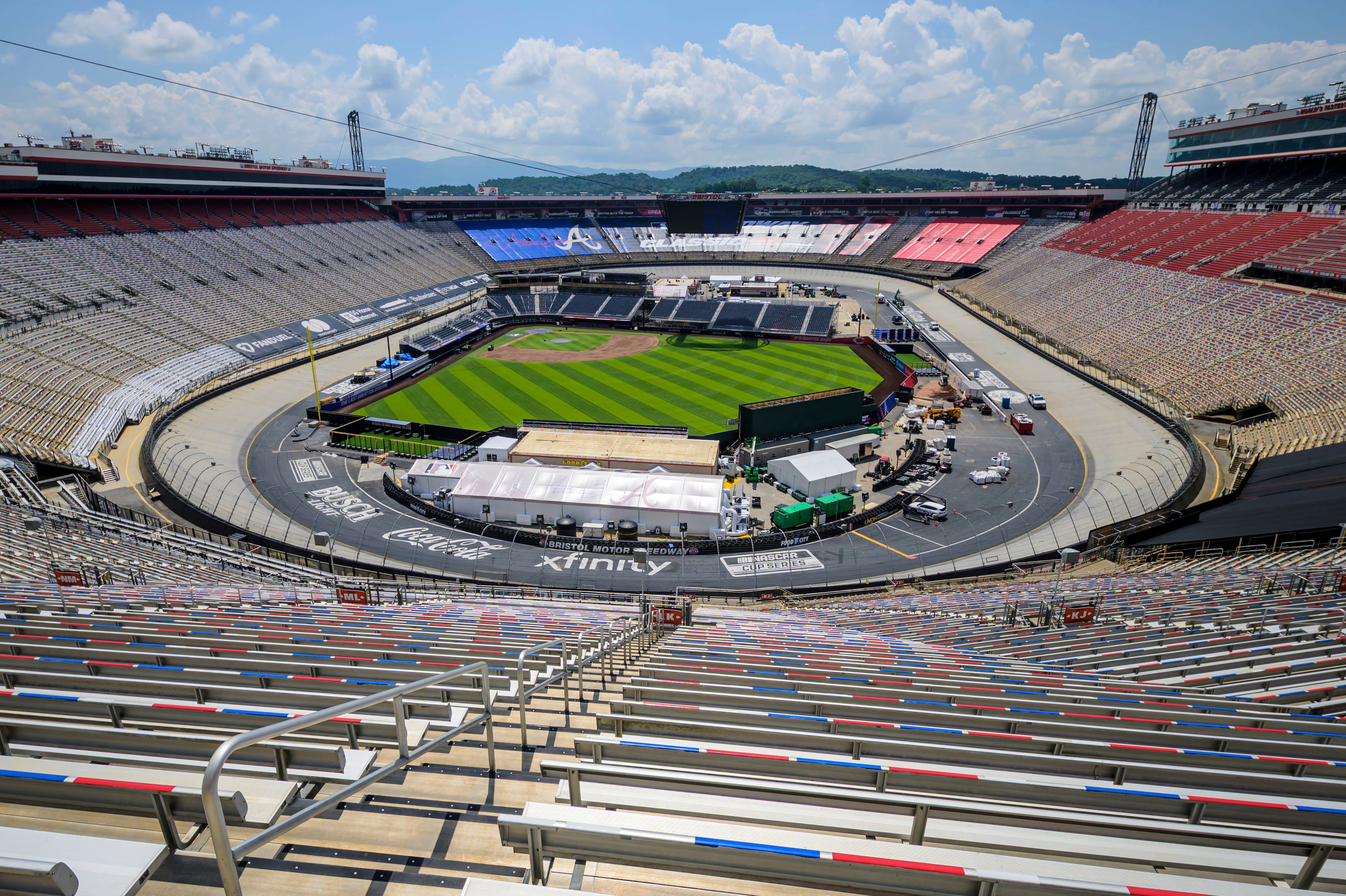 Work continues on the baseball field inside the racetrack at Bristol Motor Speedway, Friday, July 25, 2025, in Bristol, Tennessee, for MLB Speedway Classic baseball game between the Cincinnati Reds and Atlanta Braves on Aug. 2. (Earl Neikirk/Bristol Motor Speedway via AP)