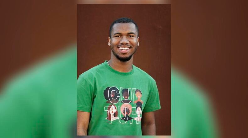 Albany State University senior visual and performing arts major Cameron Burnam shows off the shirt he designed that was a winner in the Target HBCU Design Challenge and is now featured in Target stores. (Photo Courtesy of Ansley Simmons/Albany State University)