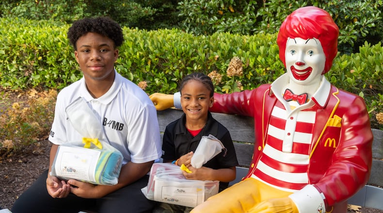 CJ Matthews (left, age 16) & his brother Kollin (7) prepare to make a delivery to the Ronald McDonald House as part of their Blankies 4 My Buddies nonprofit. When CJ was 5, his mother tragically lost his baby sister during pregnancy. CJ decided to redirect his grief to give back and spread positivity. He came up with this initiative to offer children comfort and security through blankets. His younger brother, Kollin, is now helping collect and donate the blankets. PHIL SKINNER FOR THE ATLANTA JOURNAL-CONSTITUTION