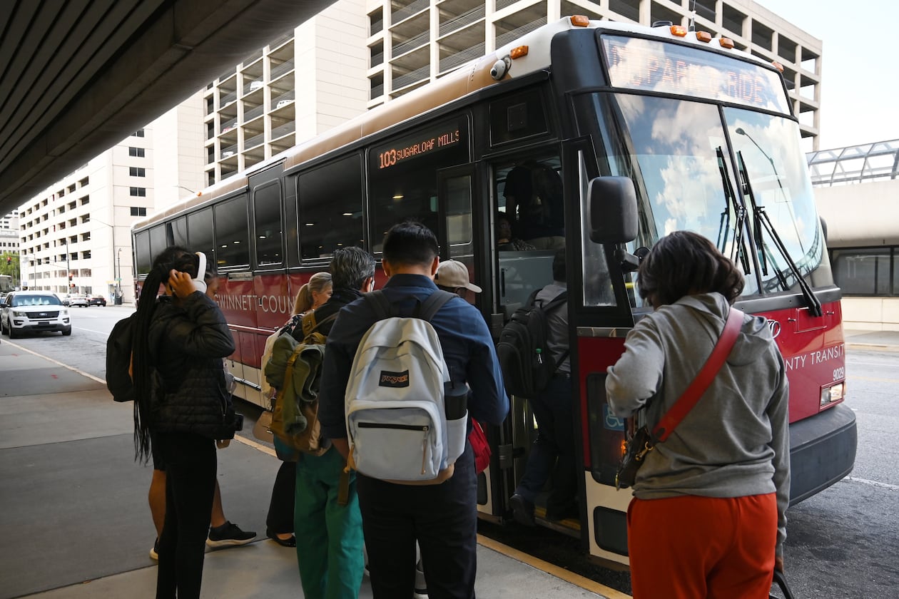 Customers get on Gwinnett County Transit bus at the Civic Center MARTA station, Thursday, September 19, 2024, in Atlanta. (Hyosub Shin / AJC)