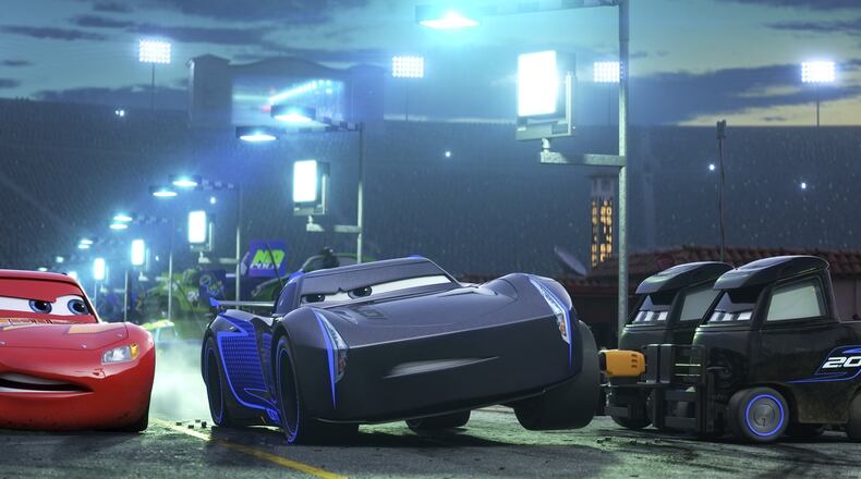 Lightning McQueen, voiced by Owen Wilson, left, and Armie Hammer voiced by Jackson Storm duke it out in “Cars 3.” Contributed by Disney-Pixar via AP