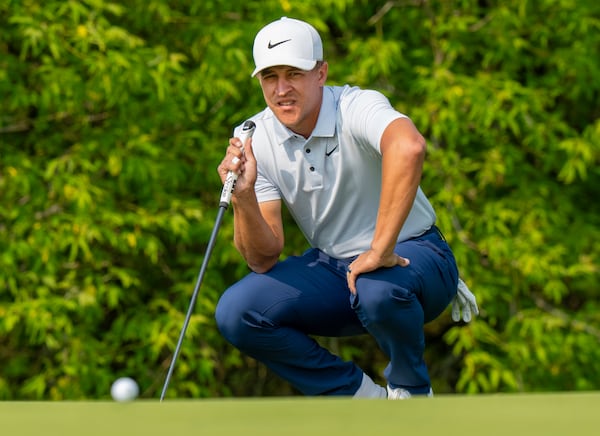 Cameron Champ of the USA watches a fellow competitor's putt roll on the 1st green of the second round of the Canadian Open in Caledon, Ont., Friday, June 6, 2025. (Frank Gunn /The Canadian Press via AP)