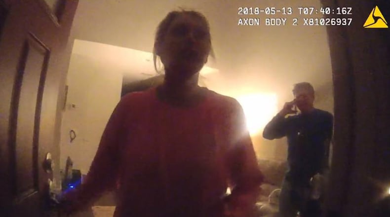 Katie Kettles Sasser at her front door the night of May 13 as officers answer a domestic incident involving her estranged husband Lt. Robert C. Sasser. This photo is from police body cam footage. The man in the background is John Hall Jr. Both Kettles Sasser and Hall were fatally shot by Lt. Sasser on June 28 at Hall’s home. Sasser then killed himself with a gunshot in a SWAT incident at his home.