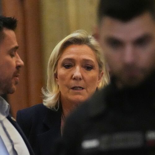 Far-right leader Marine Le Pen leaves for a break during her appeal trial after an embezzlement conviction, Tuesday, Jan. 13, 2026 in Paris. (AP Photo/Christophe Ena)