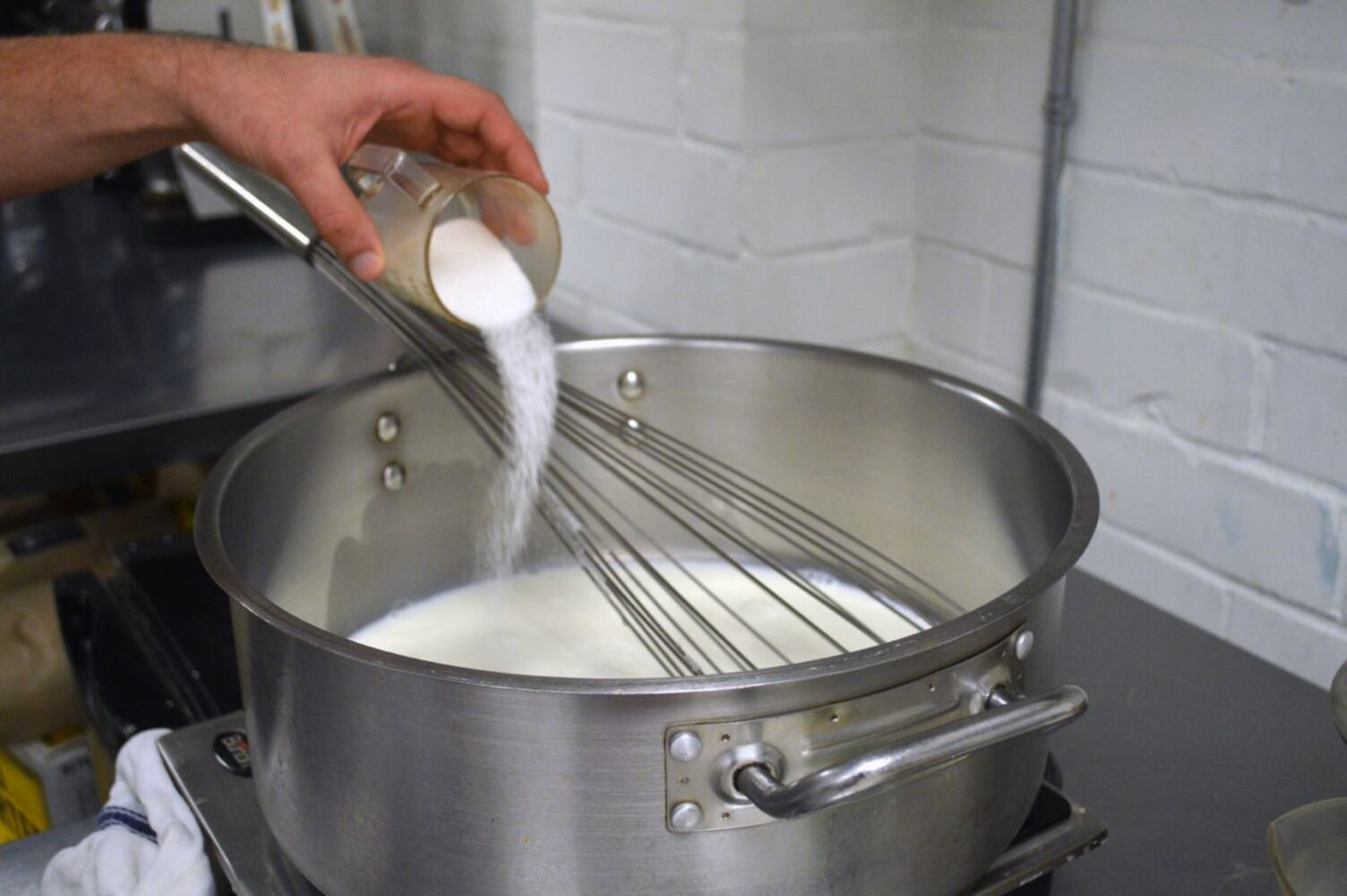 Add 1 cup of sugar to the milk