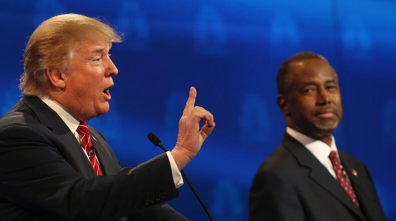 BOULDER, CO - OCTOBER 28: Presidential candidates Donald Trump (L) speaks while Ben Carson looks on during the CNBC Republican Presidential Debate at University of Colorados Coors Events Center October 28, 2015 in Boulder, Colorado. Fourteen Republican presidential candidates are participating in the third set of Republican presidential debates. (Photo by Justin Sullivan/Getty Images)