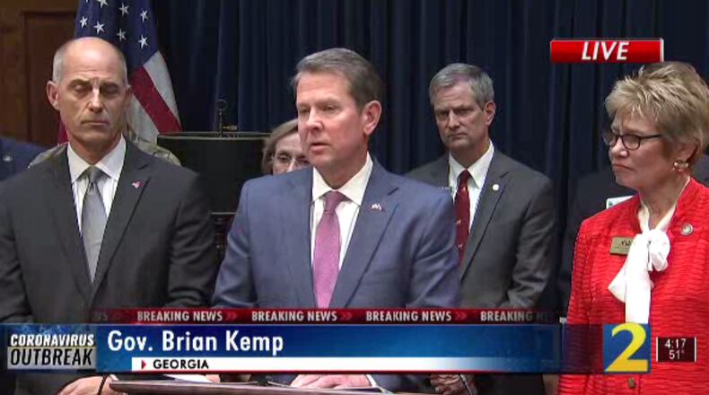 Gov. Brian Kemp addresses the media Thursday. Flooding in Georgia prompted him to issue a state of emergency.