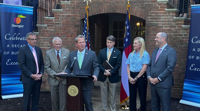 Gov. Brian Kemp touts a ranking from Area Development Magazine naming Georgia the No. 1 state for doing business for a 10th consecutive year. He's joined by Chris Cummiskey, former Gov. Nathan Deal, Economic Development Commissioner Pat Wilson, first lady Marty Kemp and Attorney General Chris Carr. AJC/Greg Bluestein