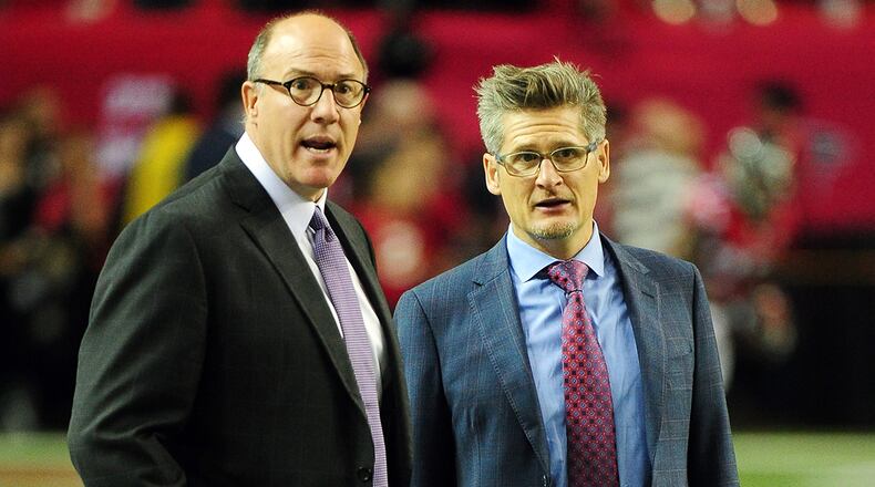 Scott Pioli (left) was brought to Atlanta by Falcons general manager Thomas Dimitroff in 2014. The two worked together in New England. (Scott Cunningham / Getty Images)