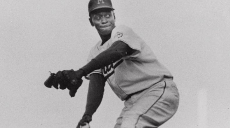 FILE--Miami Marlin's Leroy 'Satchel' Paige winds up for the pitch against the Montreal Royals in the second game of the doubleheader April 29, 1956 in Miami. (AP Photo/File)