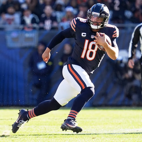 Chicago Bears quarterback Caleb Williams (18) carries the ball during the first half of an NFL football game against the Pittsburgh Steelers, Sunday, Nov. 23, 2025, in Chicago. (AP Photo/Nam Huh)