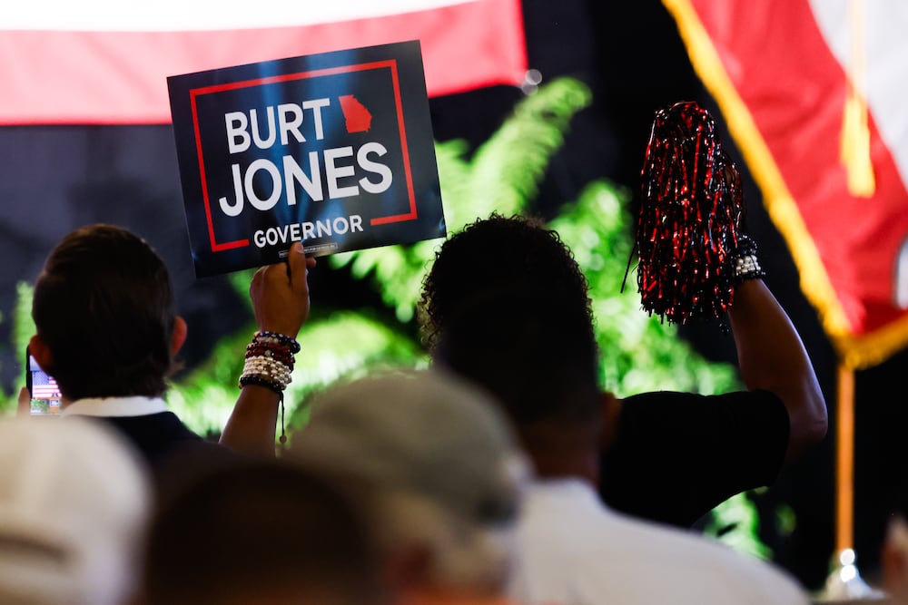 A supporter holds up a sign during a campaign rally held by Lt. Gov. Burt Jones in Flovilla on Tuesday.