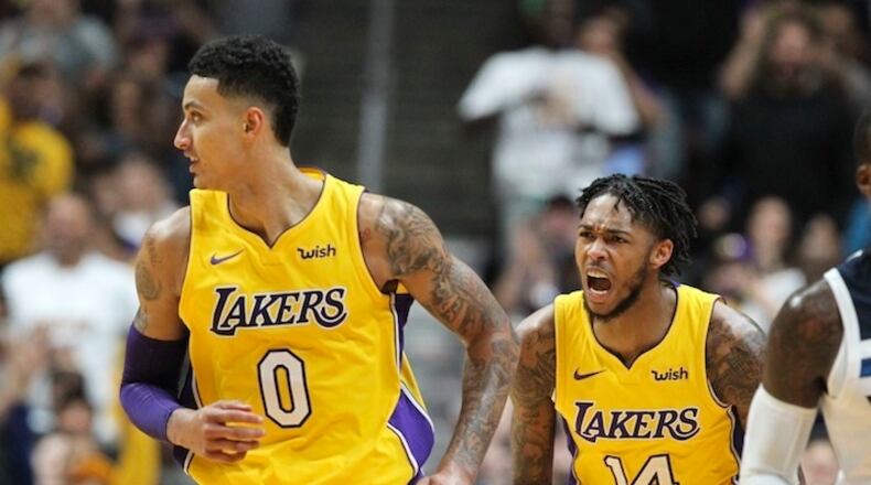 Los Angeles Lakers forward Kyle Kuzma #0 and forward Brandon Ingram #14 in actions during an NBA preseason basketball game between Los Angeles Lakers and Minnesota Timberwolves in Anaheim, Calif., Saturday, Sept. 30, 2017. (AP Photo/Ringo H.W. Chiu)
