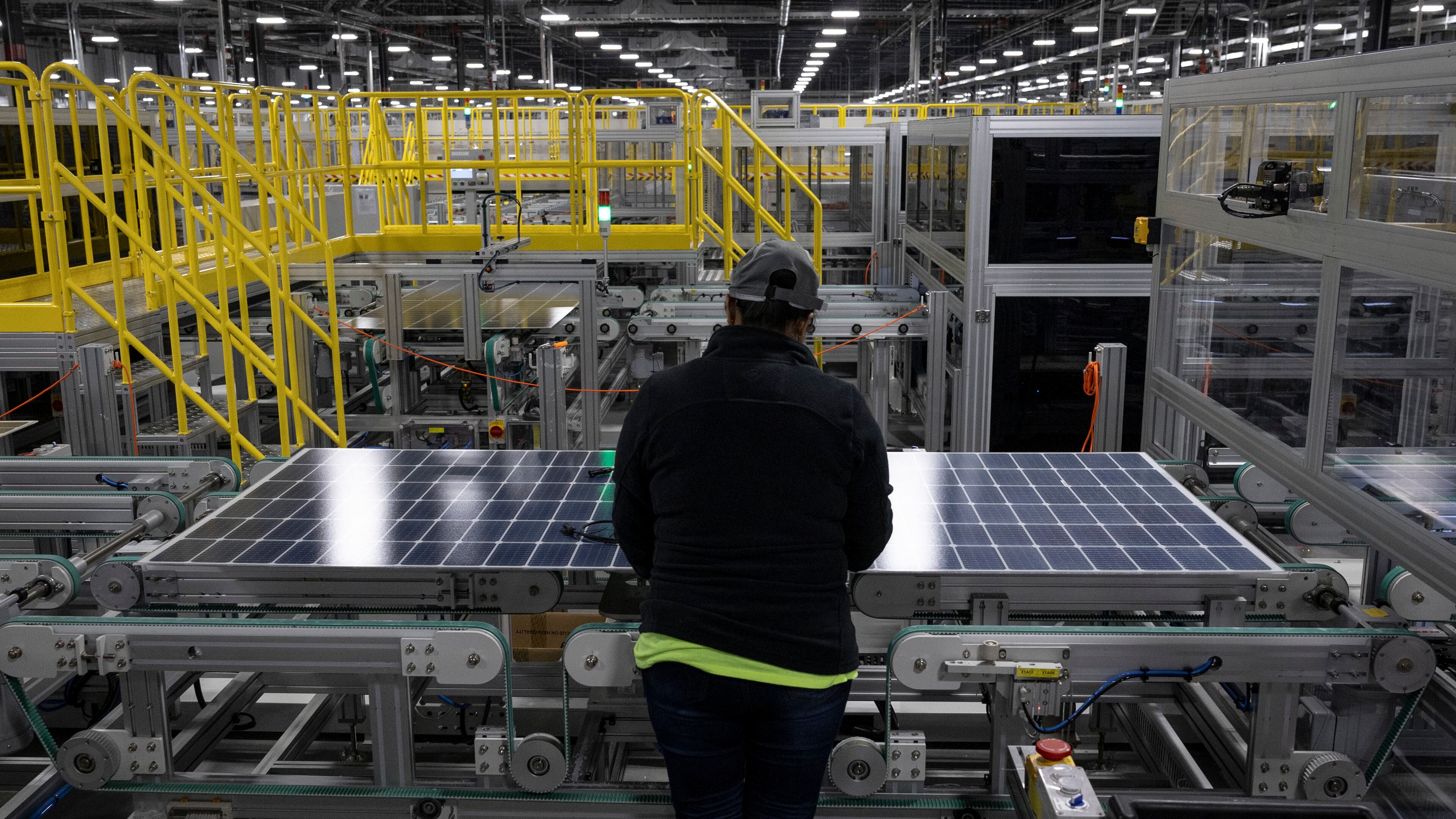 A worker inspects a solar panel at the Qcells solar panel factory in Dalton, Nov. 22, 2023. Georgia ranks among the top 10 states for solar energy capacity. (Christian Monterrosa/The New York Times)
