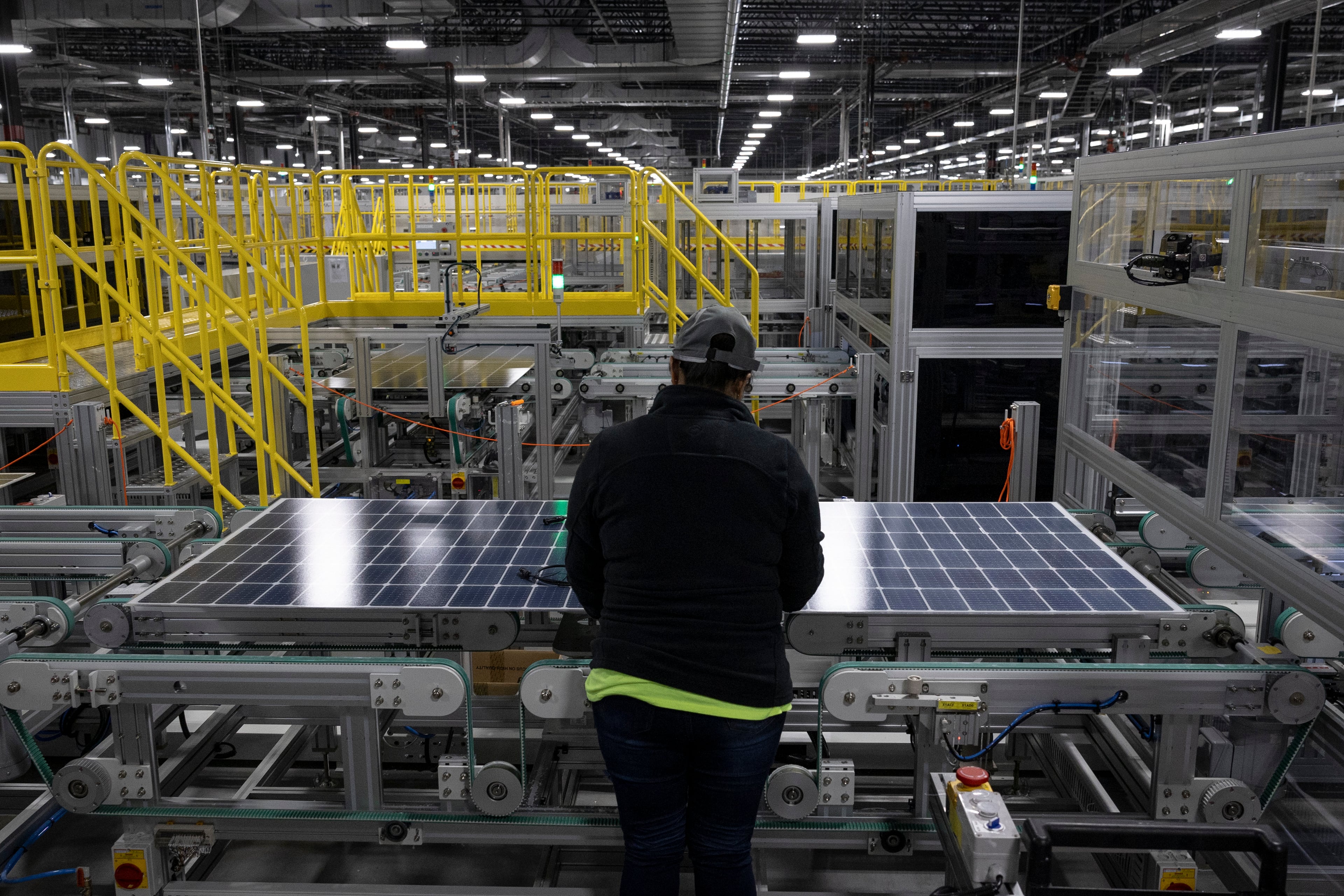 A worker inspects a solar panel at the Qcells solar panel factory in Dalton, Nov. 22, 2023. Georgia ranks among the top 10 states for solar energy capacity. (Christian Monterrosa/The New York Times)