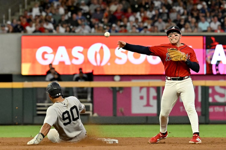 Atlanta Braves catcher Drake Baldwin (30) throws to first for the double play after forcing out New York Yankees second base Jorbit Vivas (90) during the fifth inning of a baseball game at Truist Park, Friday, July 18, 2025, in Atlanta. Atlanta Braves won 7-3 over New York Yankees. (Hyosub Shin / AJC)