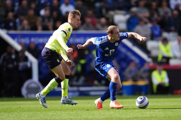 Southampton's Flynn Downes, left, and Leicester City's Oliver Skipp in action during the English Premier League soccer match between Leicester City and Southampton at the King Power Stadium, Leicester, England, Saturday May 3, 2025. (Adam Davy/PA via AP)