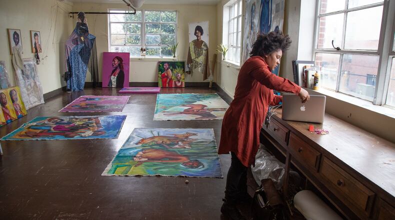 Artist Angela Davis Johnson organizes her new studio at PushPush in College Park. Contributed by Steve Schaefer