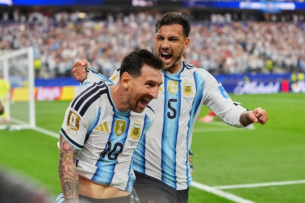 Argentina's Lionel Messi (left) celebrates after scoring his side's second goal during the World Cup Group J soccer match against Austria in Arlington, Texas on Monday, June 22, 2026. (Julio Cortez/AP)