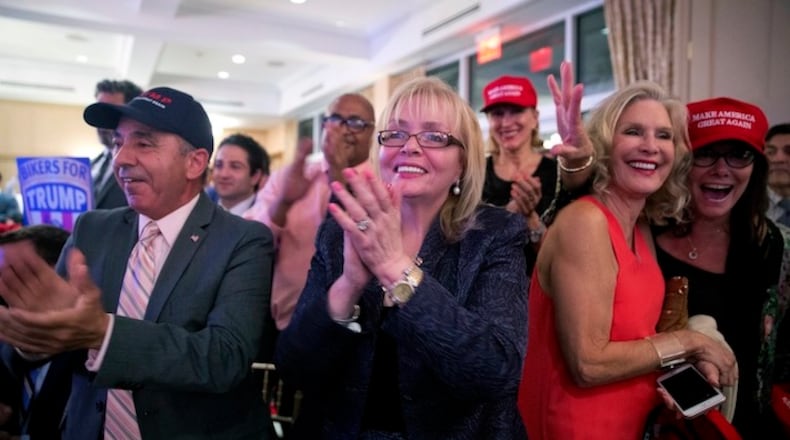 Supporters cheer as Republican presidential candidate Donald Trump speaks during a news conference at the Trump National Golf Club Westchester, Tuesday, June 7, 2016, in Briarcliff Manor, N.Y. ( Photo/Mary Altaffer)