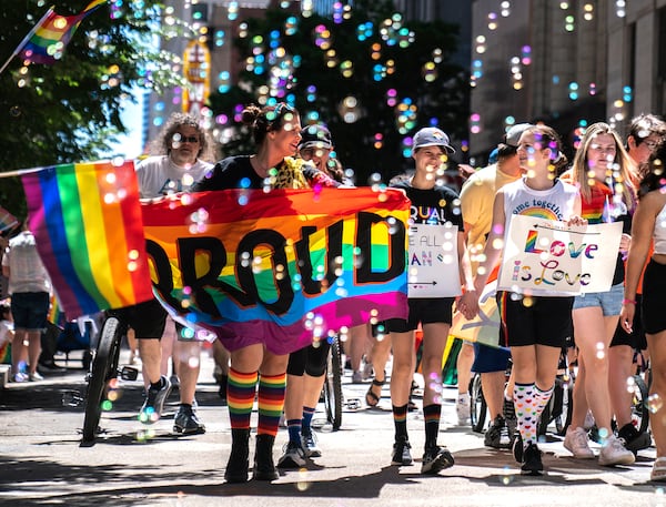 FILE - People walk in the Pittsburgh Pride Revolution March to celebrate Pride Month, June 4, 2022, in downtown Pittsburgh. (Alexandra Wimley/Pittsburgh Post-Gazette via AP, file)