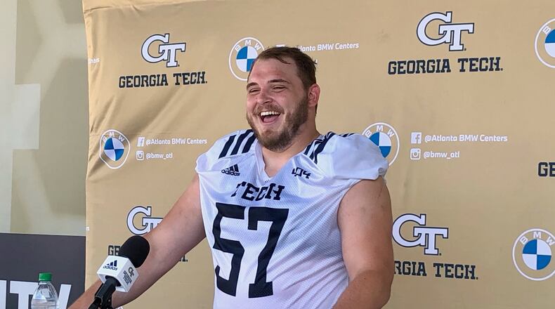Georgia Tech center Mikey Minihan speaks with media following a preseason practice Aug. 13, 2021 at Bobby Dodd Stadium. (AJC photo by Ken Sugiura)