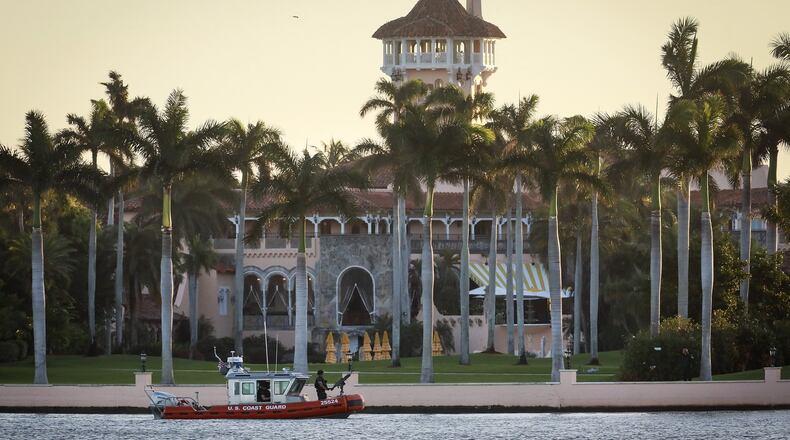 A U.S. Coast Guard boat patrols the Intracoastal Waterway just after sunrise during President-elect Donald Trump’s stay at Mar-a-Lago in Palm Beach Friday, November 25, 2016. (Bruce R. Bennett / The Palm Beach Post)