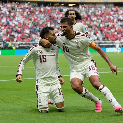 Spain's Alex Baena, left, is congratulated after scoring his side's opening goal by Rodri during the World Cup Group H soccer match between Uruguay and Spain in Zapopan, near Guadalajara, Mexico, Friday, June 26, 2026. (AP Photo/Natacha Pisarenko)