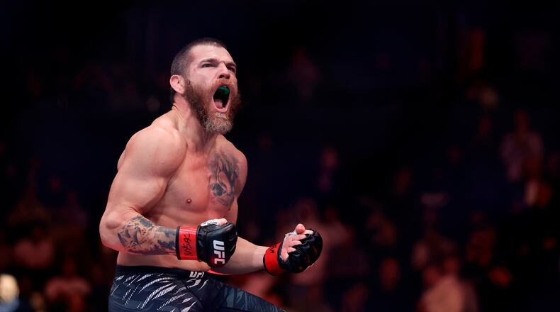 FILE - Jim Miller reacts after defeating Damon Jackson in a UFC 309 mixed martial arts lightweight title bout, Nov. 16, 2024, in New York. (AP Photo/Adam Hunger, File)