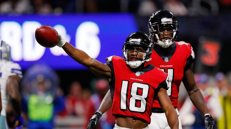 Falcons wide receiver Taylor Gabriel signals a first down during the second half against the Cowboys at Mercedes-Benz Stadium on November 12 in Atlanta.