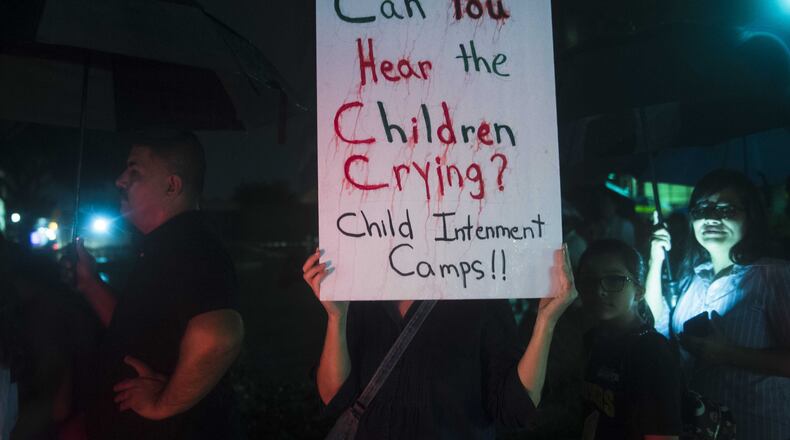 Groups make their way through downtown McAllen, TX, during a vigil and prayer walk on Wednesday, June 20, 2018. Participants walked from Archer Park to the federal courthouse a few blocks away, in honor of immigrant families and children who have been separated at the border.