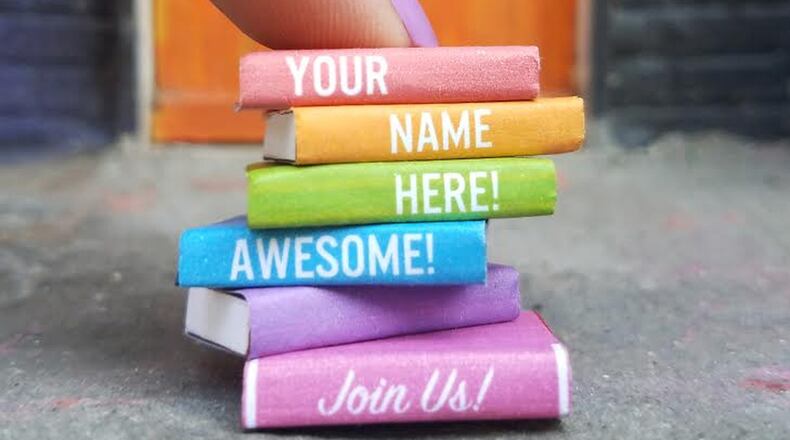 The easiest way you’ll ever get your name on a book: This photo shows the size and look of the books that will be in Tiny Doors ATL’s tiny library; for as little as $25, you can put a name or message on a book, and help support Atlanta’s “tiniest public art project.” CONTRIBUTED BY TINY DOORS ATL