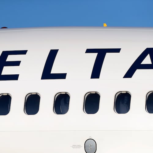 FILE - In this June 26, 2019, file photo, the company logo graces the side of a Delta Air Lines jetliner at Denver International Airport in Denver. (AP Photo/David Zalubowski, File)