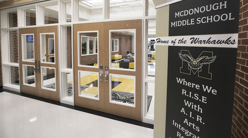 The main entrance to McDonough Middle includes a security feature that requires the school to buzz visitors in. BOB ANDRES / ROBERT.ANDRES@AJC.COM