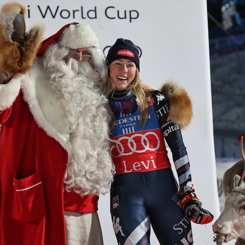 FILE - United States' Mikaela Shiffrin poses with Santa Claus as she celebrates on the podium after winning an alpine ski, women's World Cup slalom, in Levi, Finland, on Nov. 15, 2025. (AP Photo/Marco Trovati, File)