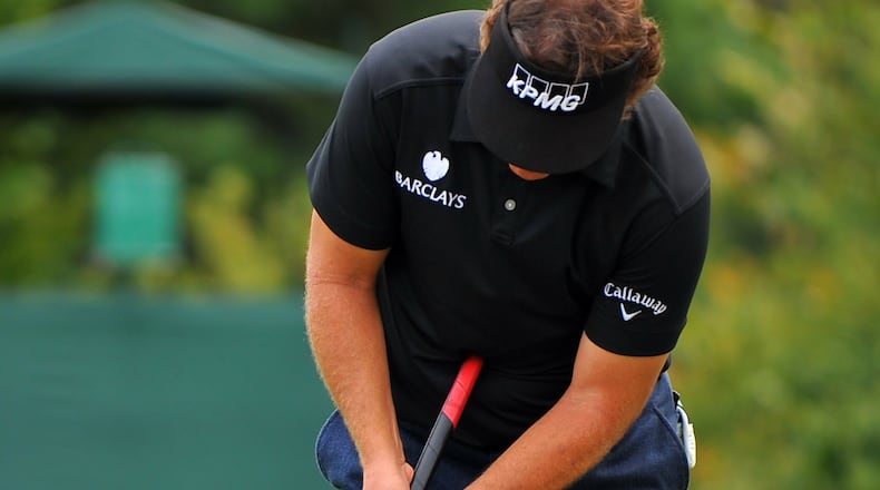 Former Masters champion Phil Mickelson is among a growing group of golfers favoring the anchored putting grip.