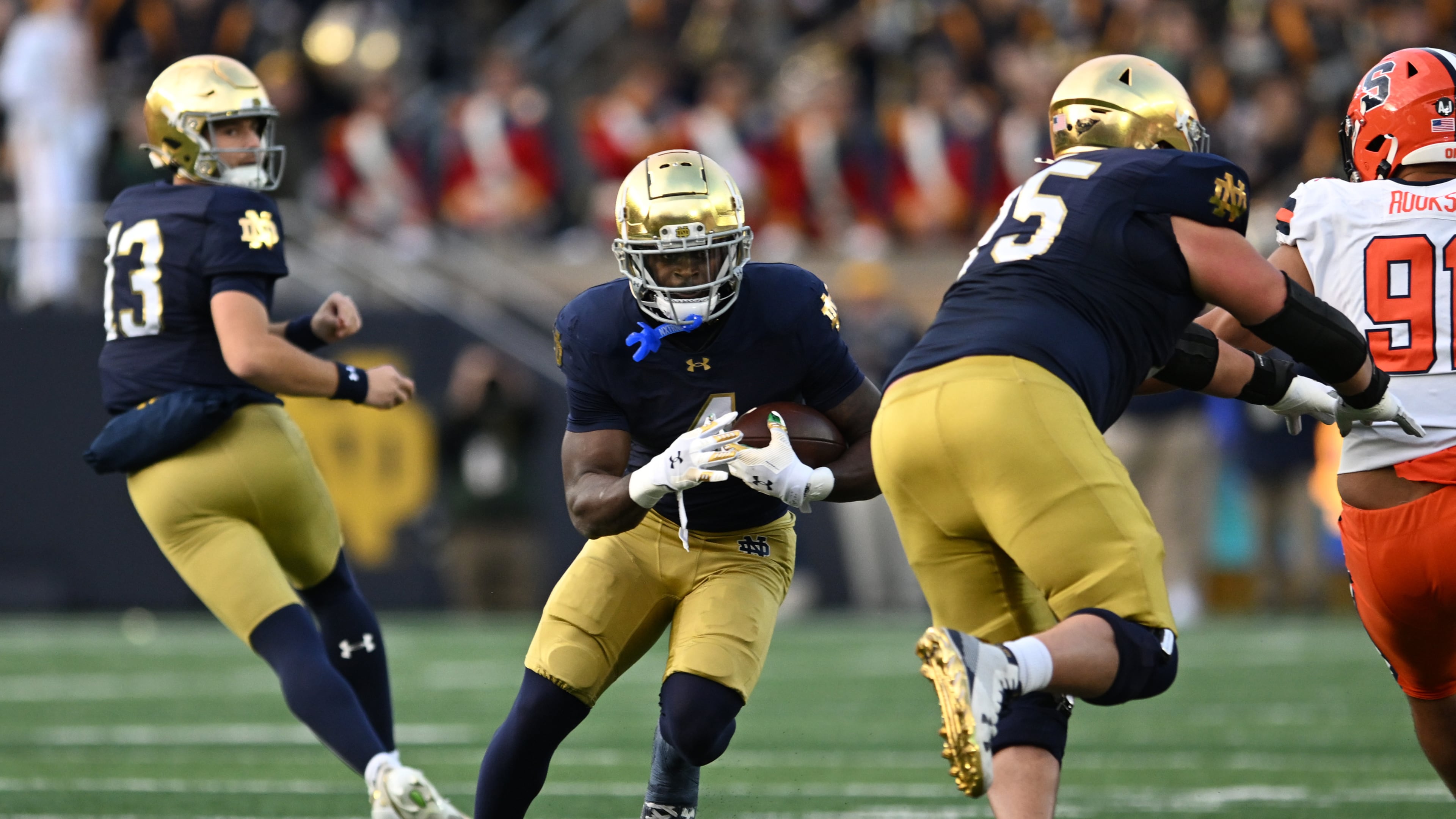 Notre Dame running back Jeremiyah Love (4) rushes during the first quarter of an NCAA football game against Syracuse, Saturday, Nov. 22, 2025, in South Bend, Ind. (AP Photo/Paul Beaty)