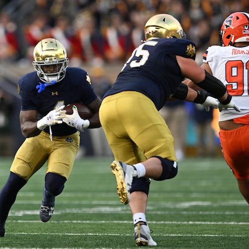 Notre Dame running back Jeremiyah Love (4) rushes during the first quarter of an NCAA football game against Syracuse, Saturday, Nov. 22, 2025, in South Bend, Ind. (AP Photo/Paul Beaty)