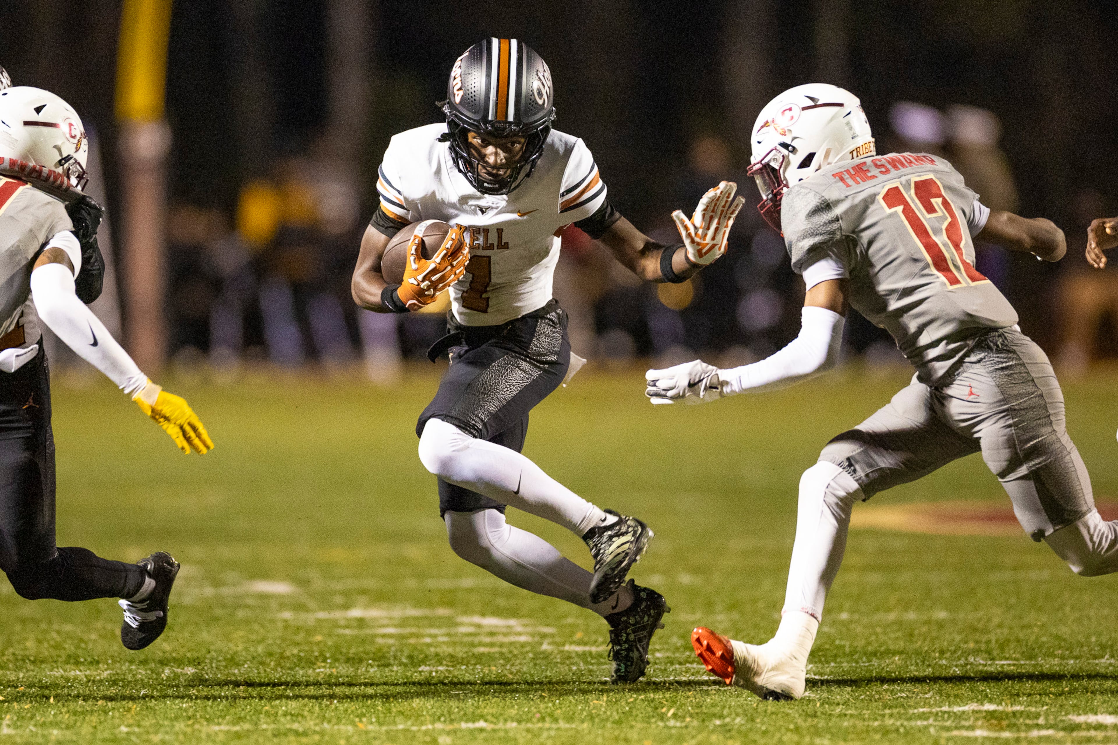 Kell linebacker Michael Domanik (1) blocks Creekside cornerback Tyree Colzie (12) during the first half of the class 4A semifinal against Creekside at Creekside High School in Fairburn, GA on Friday, December 5, 2025. (Oscar Guevara Saenz for the AJC)