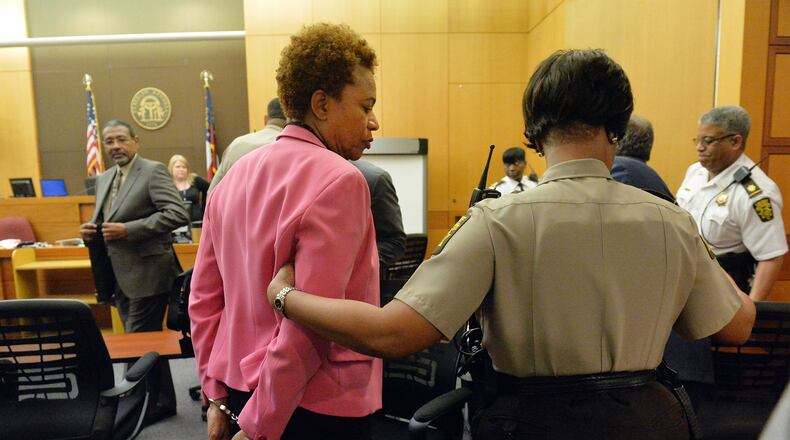 APRIL 1, 2015 ATLANTA Former APS SRT Director Sharon Davis Williams is led to a holding cell following her condition on VIOLATION OF RACKETEER INFLUENCED AND CORRUPT ORGANIZATIONS ACT charges Wednesday. A jury of six men and six women render their verdicts on the seventh day in the Atlanta Public Schools test-cheating trial on Wednesday, April 1, 2015. Jurors sorted through roughly five months of testimony against 12 former educators accused of engaging in a racketeering conspiracy to inflate test scores. (Atlanta Journal-Constitution, Kent D. Johnson, Pool)
