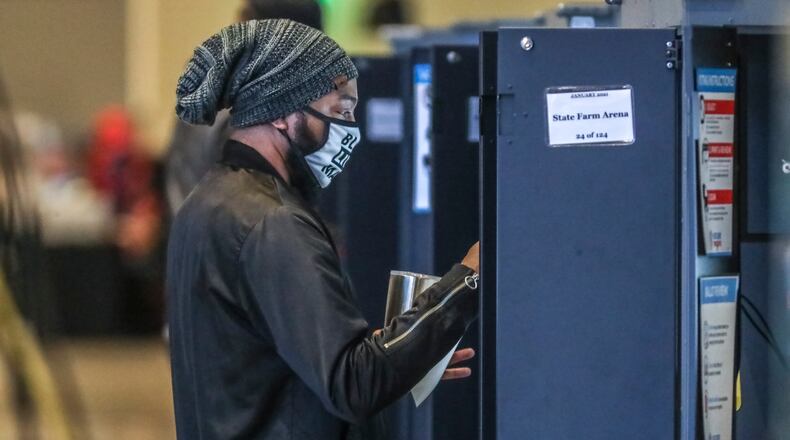 December 14, 2020 Atlanta: Voters came to State Farm Arena on Monday, Dec. 14, 2020 to cast their votes to determine which political party controls the U.S. Senate on the first day of early voting. Both of Georgia’s Senate seats are up for grabs as Republican incumbent Sens. David Perdue and Kelly Loeffler try to hold of Democratic challengers Jon Ossoff and Raphael Warnock. Democrats would need to win both seats to flip control of the Senate. Early voting started at 8:30 a.m. in Fulton County. Thirty-two voting locations are open and listed on the Fulton County website. Early voting locations were also open elsewhere in the state, including in Cobb, DeKalb and Gwinnett counties. Early voters may cast their ballot at any location in their county. In Fulton County, weekday voting hours are 8:30 a.m.-6 p.m. through Dec. 23. Hours are extended to 7 a.m.-7 p.m. from Dec. 28-30. On Saturdays, Dec. 19 and Dec. 26, voting will be held 8:30 a.m.-6 p.m. On Sundays, Dec. 20 and Dec. 27, voting locations are open noon-6 p.m. Voting locations include State Farm Arena from Dec. 14-19; and Mercedes-Benz Stadium from Dec. 22-Dec. 30. Wait time estimates at polling locations will available on the Fulton County website and the Fulton Votes mobile app, an official said. Polls will be closed Dec. 24-25 and Dec. 31-Jan. 1 in observance of the Christmas and New Year’s holidays. Election Day is Tuesday, Jan. 5. (John Spink / John.Spink@ajc.com)