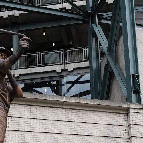 The bat on the statue of former Seattle Mariners right fielder Ichiro Suzuki is broken during the unveiling ceremony outside of T-Mobile Park, Friday, April 10, 2026, in Seattle. (AP Photo/Lindsey Wasson)