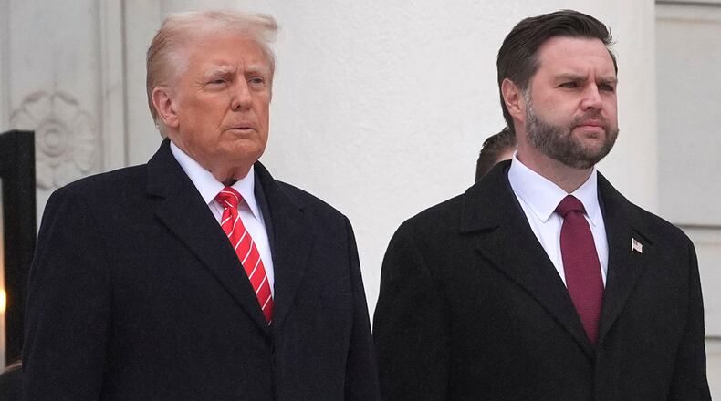 President-elect Donald Trump and Vice President-elect JD Vance arrive for a wreath laying ceremony at Arlington National Cemetery, Sunday, Jan. 19, 2025, in Arlington, Va. (AP Photo/Evan Vucci)