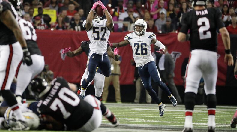 Atlanta Falcons quarterback Matt Ryan (2) throws an interception to San Diego Chargers inside linebacker Denzel Perryman (52) during the second half of an NFL football game, Sunday, Oct. 23, 2016, in Atlanta. (AP Photo/David Goldman)