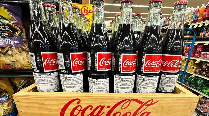 FILE - Bottles of Mexican Coca-Cola are displayed at a grocery store in Mount Prospect, Ill., Thursday, July 17, 2025. (AP Photo/Nam Y. Huh, File)