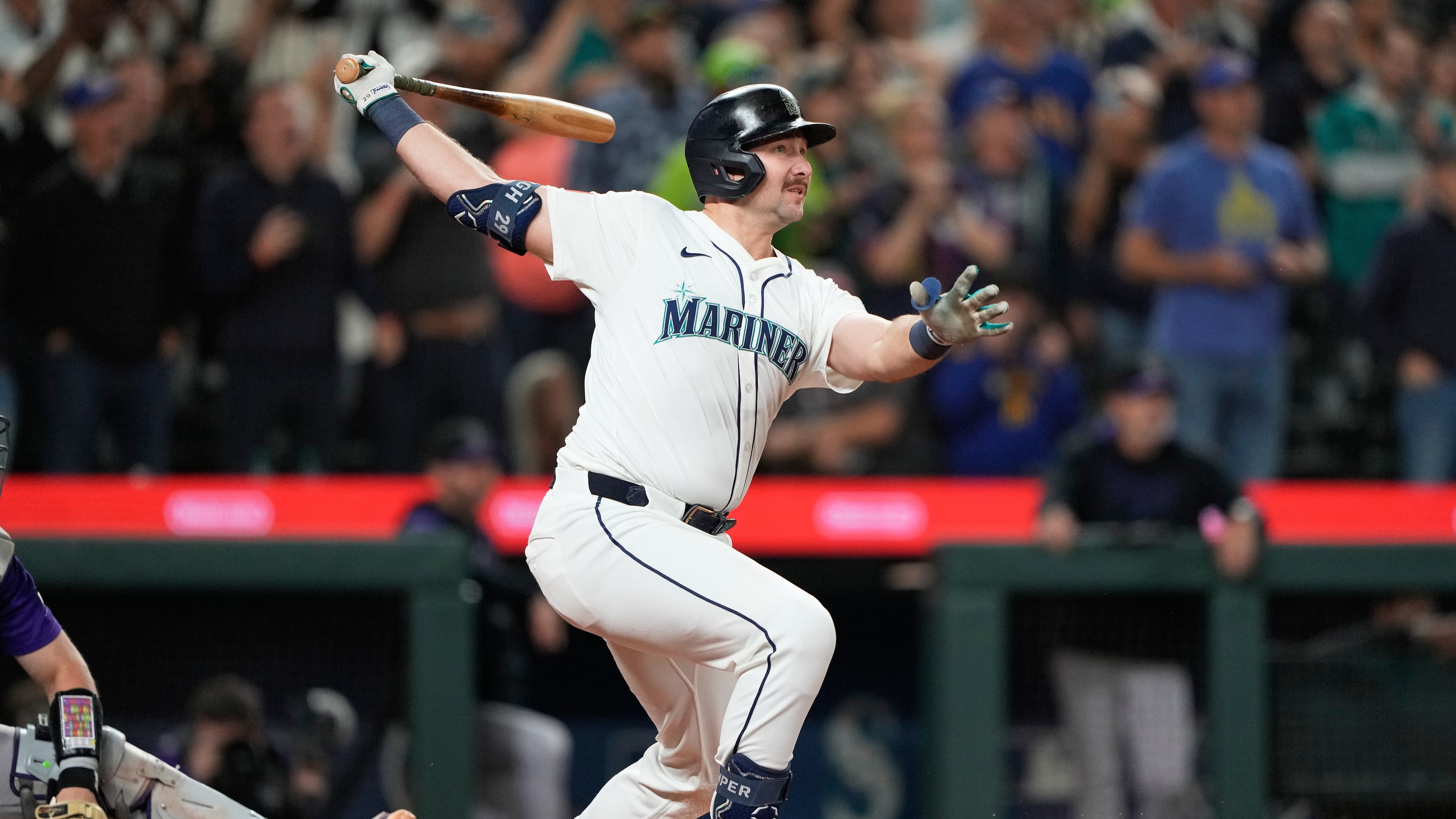 Seattle Mariners' Cal Raleigh watches his 60th home run during the eighth inning of a baseball game against the Colorado Rockies, Wednesday, Sept. 24, 2025, in Seattle. (AP Photo/Ryan Sun)