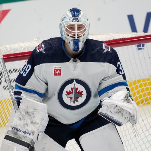 FILE - Winnipeg Jets goaltender Laurent Brossoit minds the net during an NHL hockey game against the Dallas Stars in Dallas, April 11, 2024. (AP Photo/Tony Gutierrez, File)