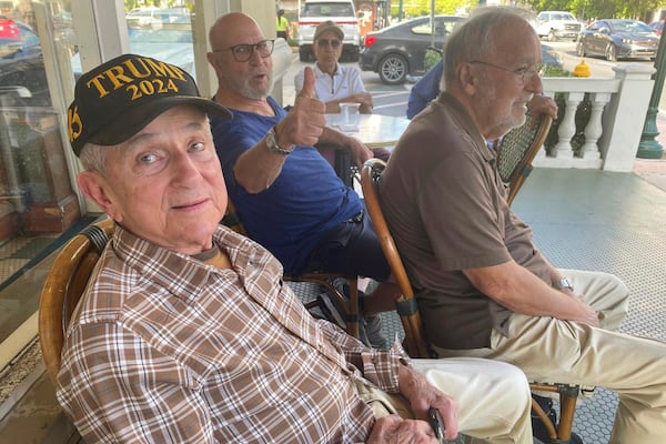In this undated photo MAGA fans hang out at Café Versailles in Little Havana, Miami, Fla. (AP Photo/Josh Goodman)