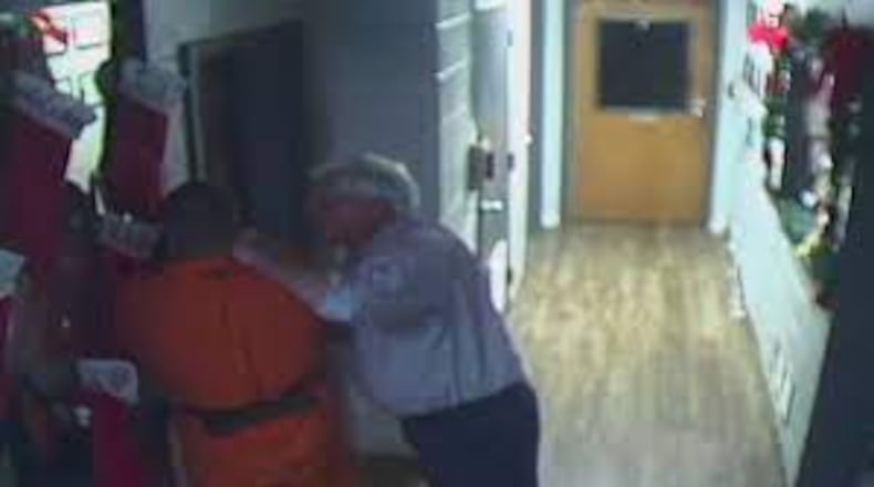 Chief Magistrate Cary Hays III pinning defendant against a wall in a courthouse hallway in December 2020. (Photo courtesy of Channel 2 Action News)