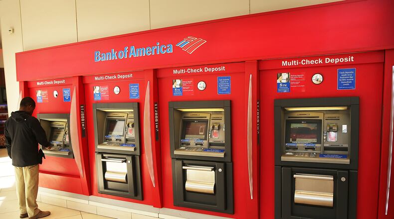 NEW YORK, NY - APRIL 16: A man uses an ATM at a Bank of America branch on April 16, 2014 in New York City. (Photo by Spencer Platt/Getty Images)
